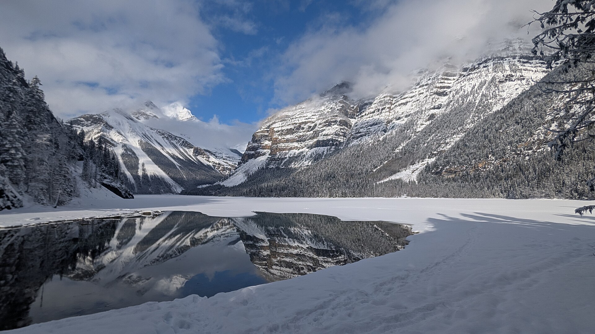 Winter mountains reflected in Kinney Lake, February 2026