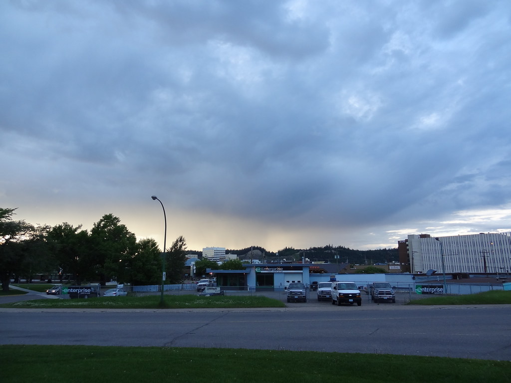 Heavy evening clouds above downtown Prince George and an empty street