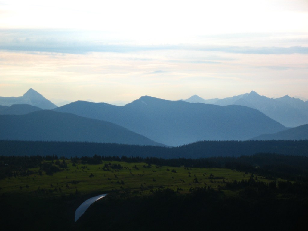 The view east from Mount Agnes in the Cariboo Mountains, 20 July 2008, with a snow patch below the alpine meadow